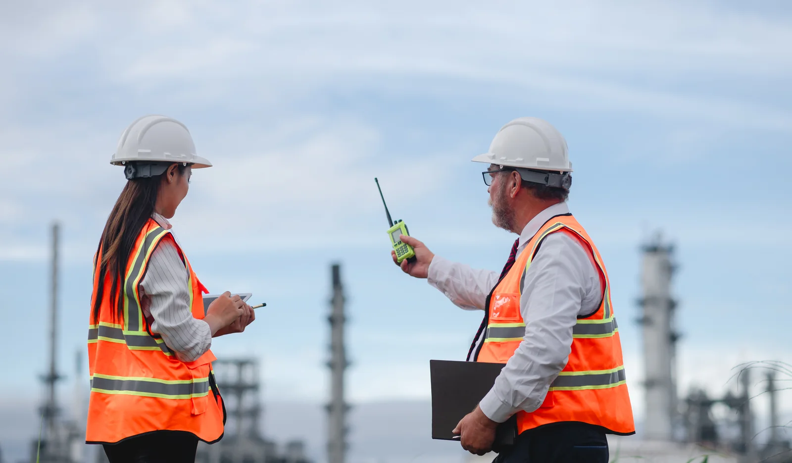 engineers-inspecting-industrial-site-with-radio-co-2026-03-27-01-49-41-utc