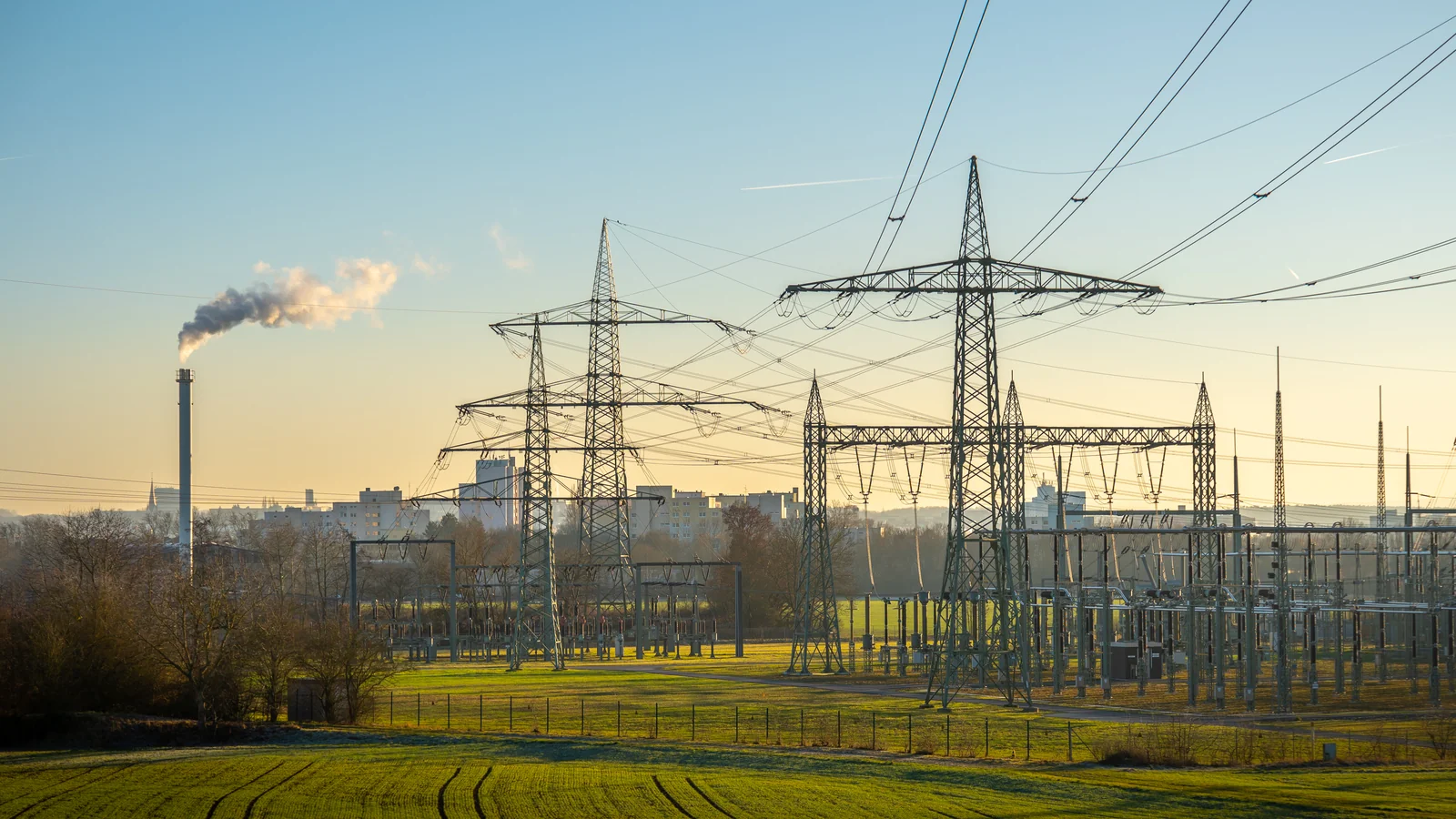 industrial-zone-with-high-voltage-transmission-tow-2026-03-18-09-33-49-utc